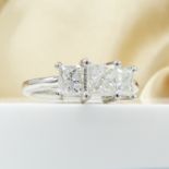 Dazzling certificated 3-stone F-G colour princess-cut graduated diamond trilogy ring