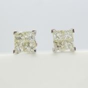 Pair of screw back, invisible set 2.00 carat princess-cut diamond stud earrings