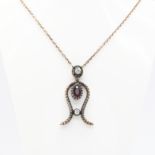 Vintage necklace with milligrain-style pendant set with ruby and diamonds