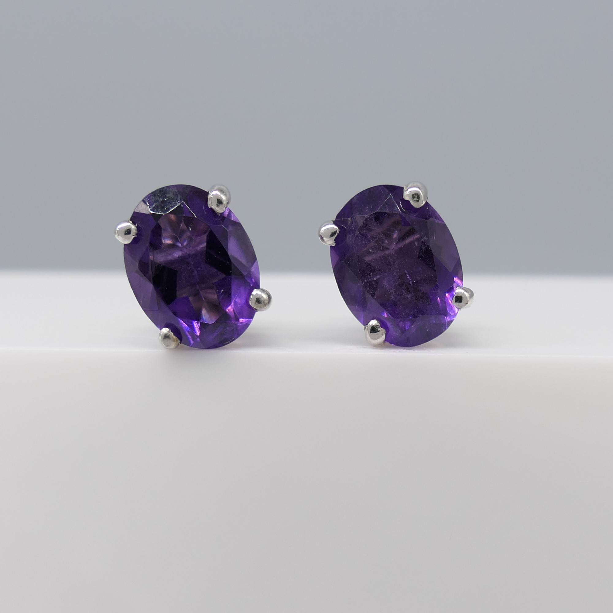 Pair of natural purple amethyst gemstone ear studs in silver