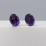 Pair of natural purple amethyst gemstone ear studs in silver