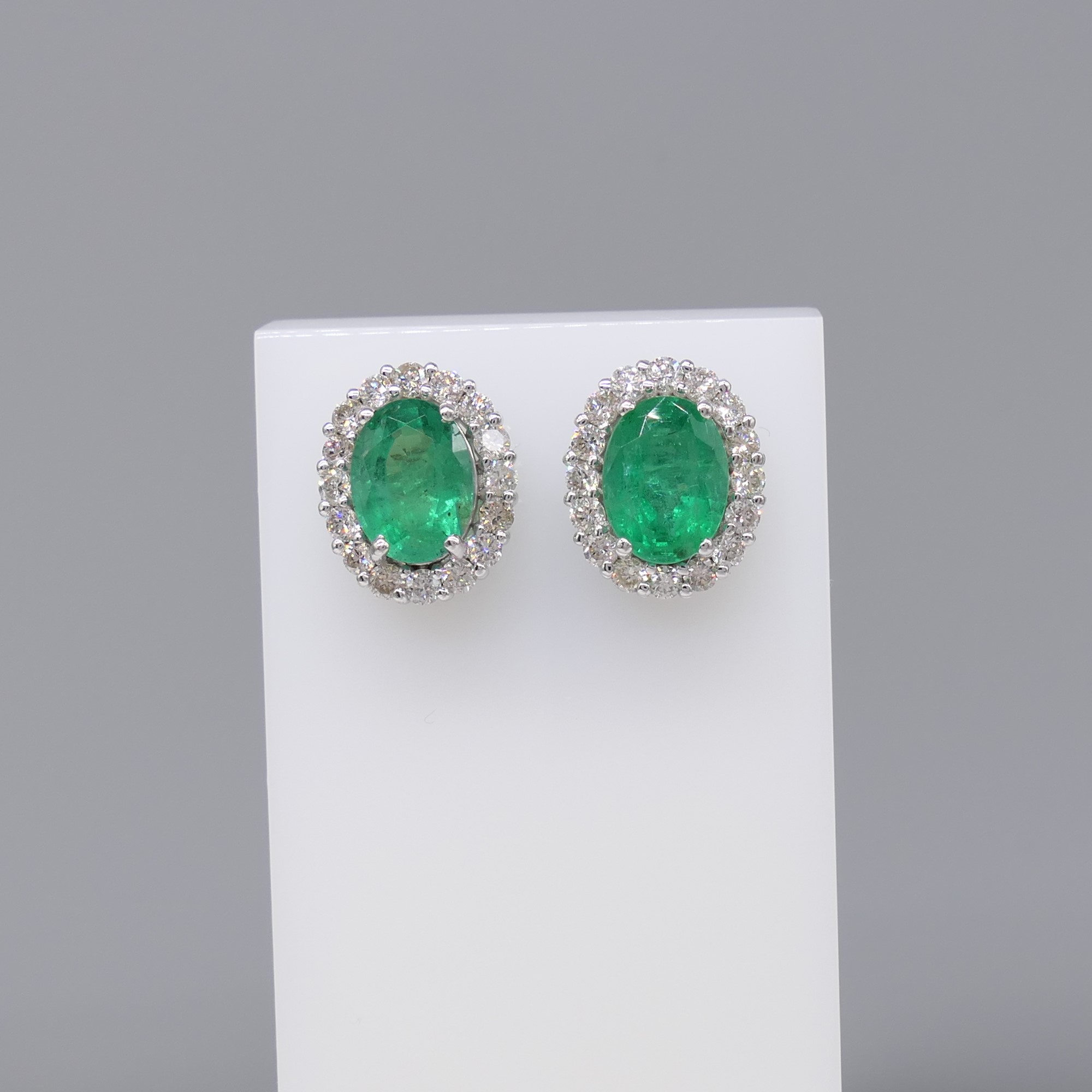 Pair of 18ct white gold oval emerald and diamond cluster ear studs, boxed - Image 2 of 7