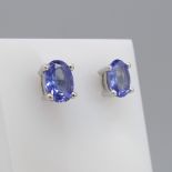 A pair of sterling silver oval tanzanite stud earrings