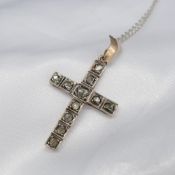 Antique, hand fashioned rose-cut diamond cross pendant in yellow gold and silver