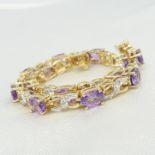 Yellow gold articulated bracelet set with amethysts and diamonds, boxed