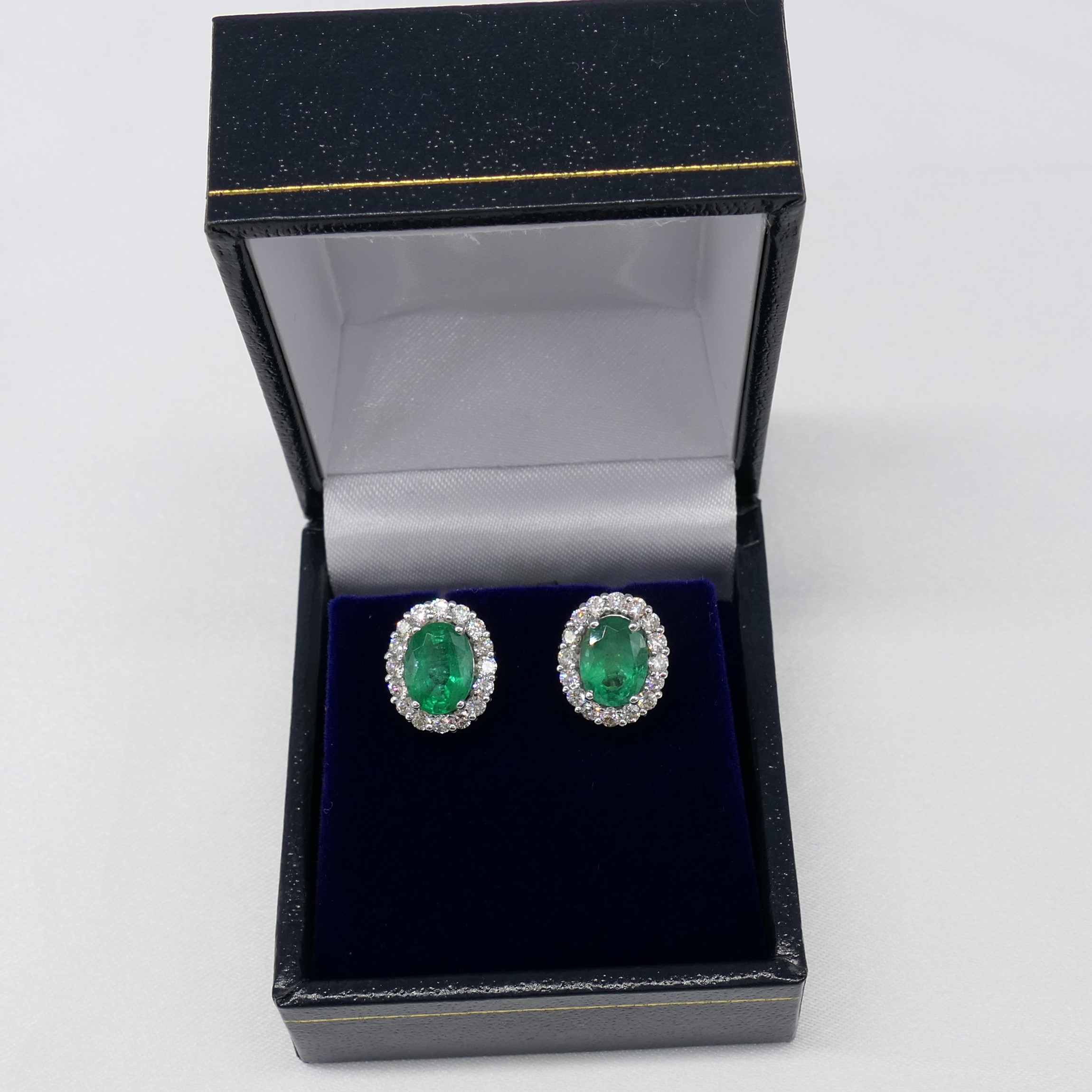 Pair of 18ct white gold oval emerald and diamond cluster ear studs, boxed - Image 4 of 7