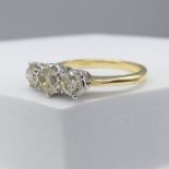 18ct yellow and white gold 1.16 carat diamond trilogy ring, with certificate.