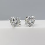 Pair of 18ct white gold 1.76 carat moissanite solitaire stud earrings in white gold.