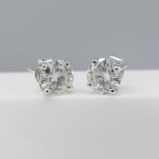 Pair of 18ct white gold 1.76 carat moissanite solitaire stud earrings in white gold.