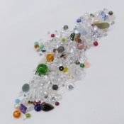 A parcel of 95.00 carats of mixed loose gems, stones and beads including quartz and cubic zirconia.