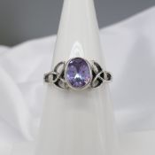 Sterling silver Celtic-style dress ring set with an oval purple cubic zirconia.