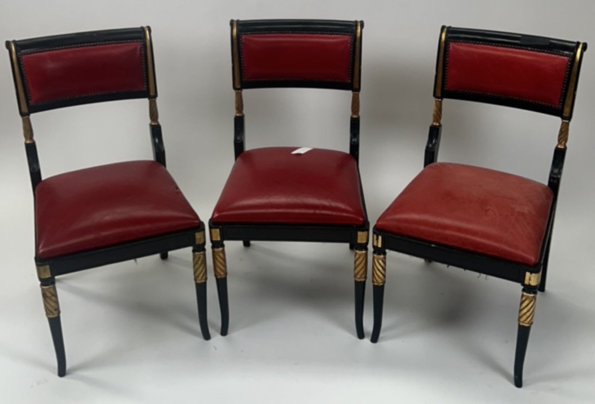 Trio of regency ebonised gilt dining chairs