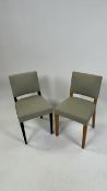 A pair of Wooden dining chairs with fabric seats