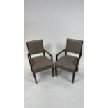 A pair of Wooden framed armchairs