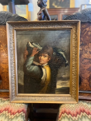 Oil painting on board in a gilt frame, showing a young boy with a basket of fish on his shoulder.