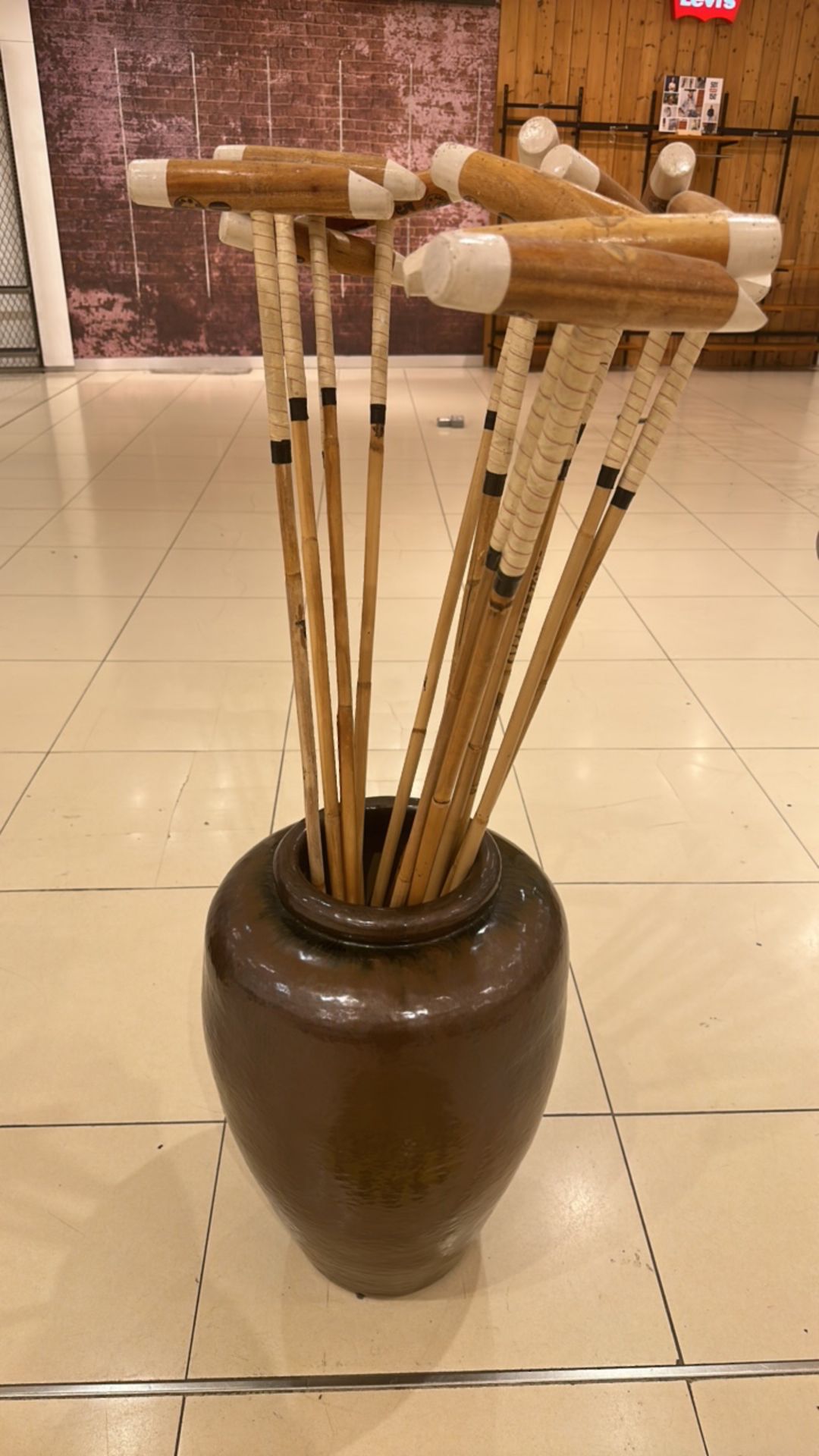 Polo Sticks With Large Ceramic Vases
