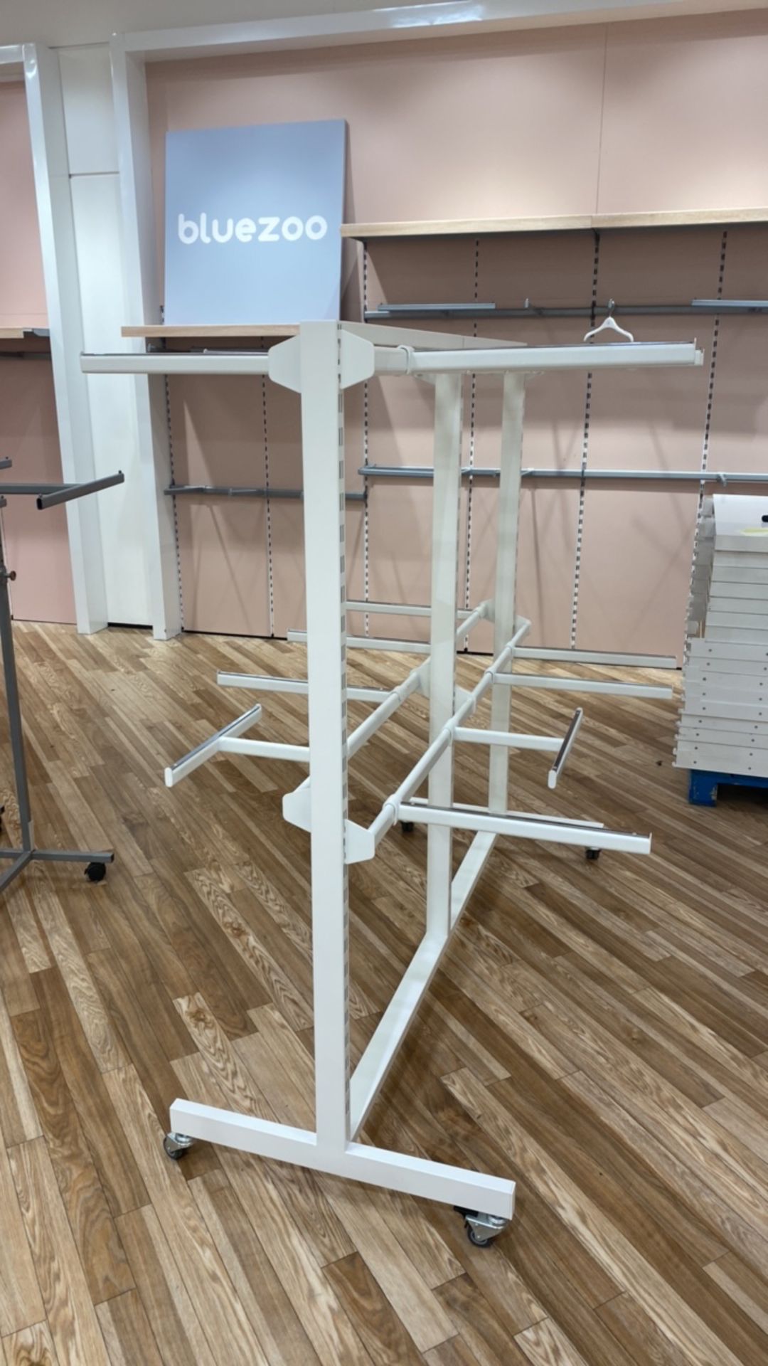 White Meral Hanger Display Stand On Castors