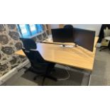 Office desk with chair and monitors