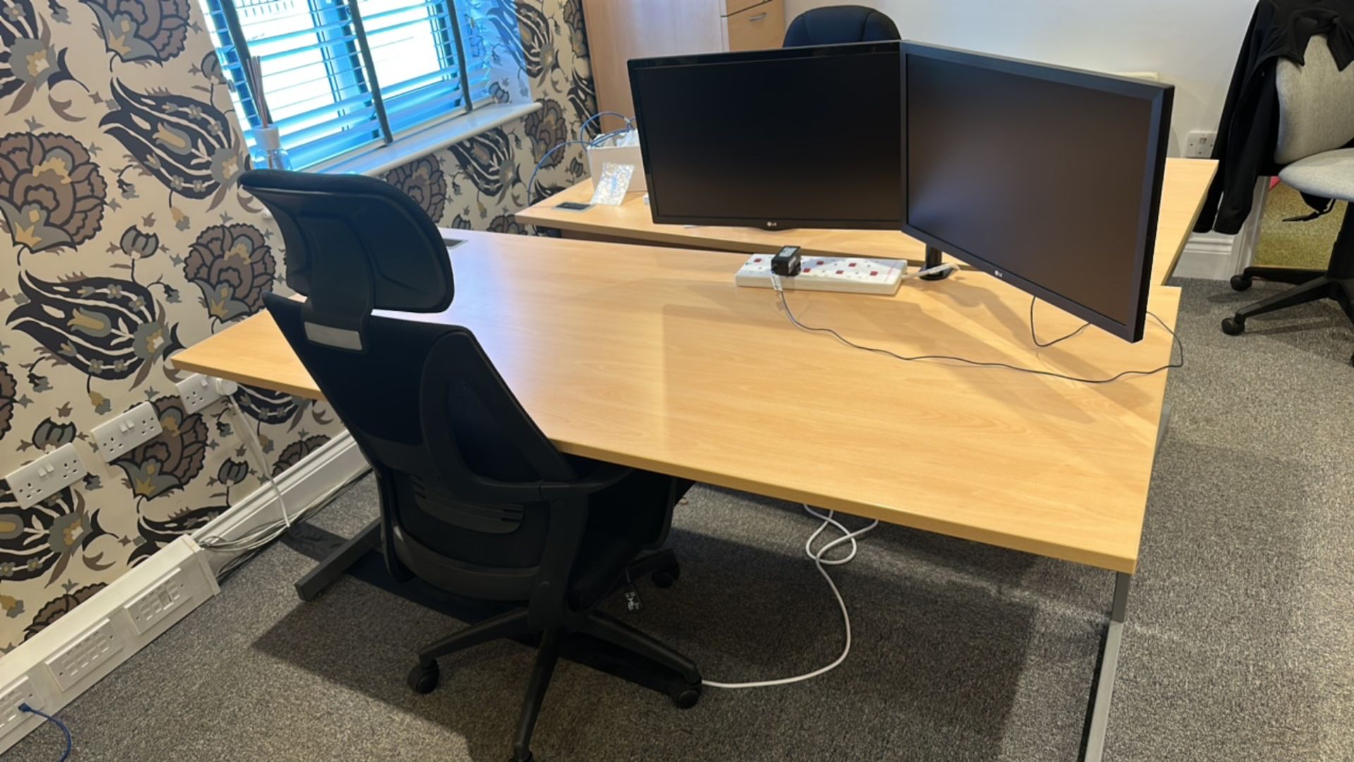 Office desk with chair and monitors