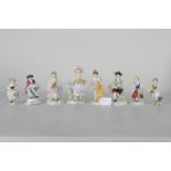 8teilige Sammlung verschiedener polychrom staffierte Weißporzellanfiguren; max. Höhe ca. 17 cm. Ver
