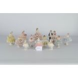 12-teilige Sammlung versch. Porzellanfiguren, überwiegend tanzende Damen, versch. Alter, Größen, Ma