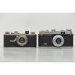 2 ältere Photoapparate , 1 x mit Leitz Elmar Objektiv und 1 x mit Oplar - Objektiv. Ungeprüft. Ohne