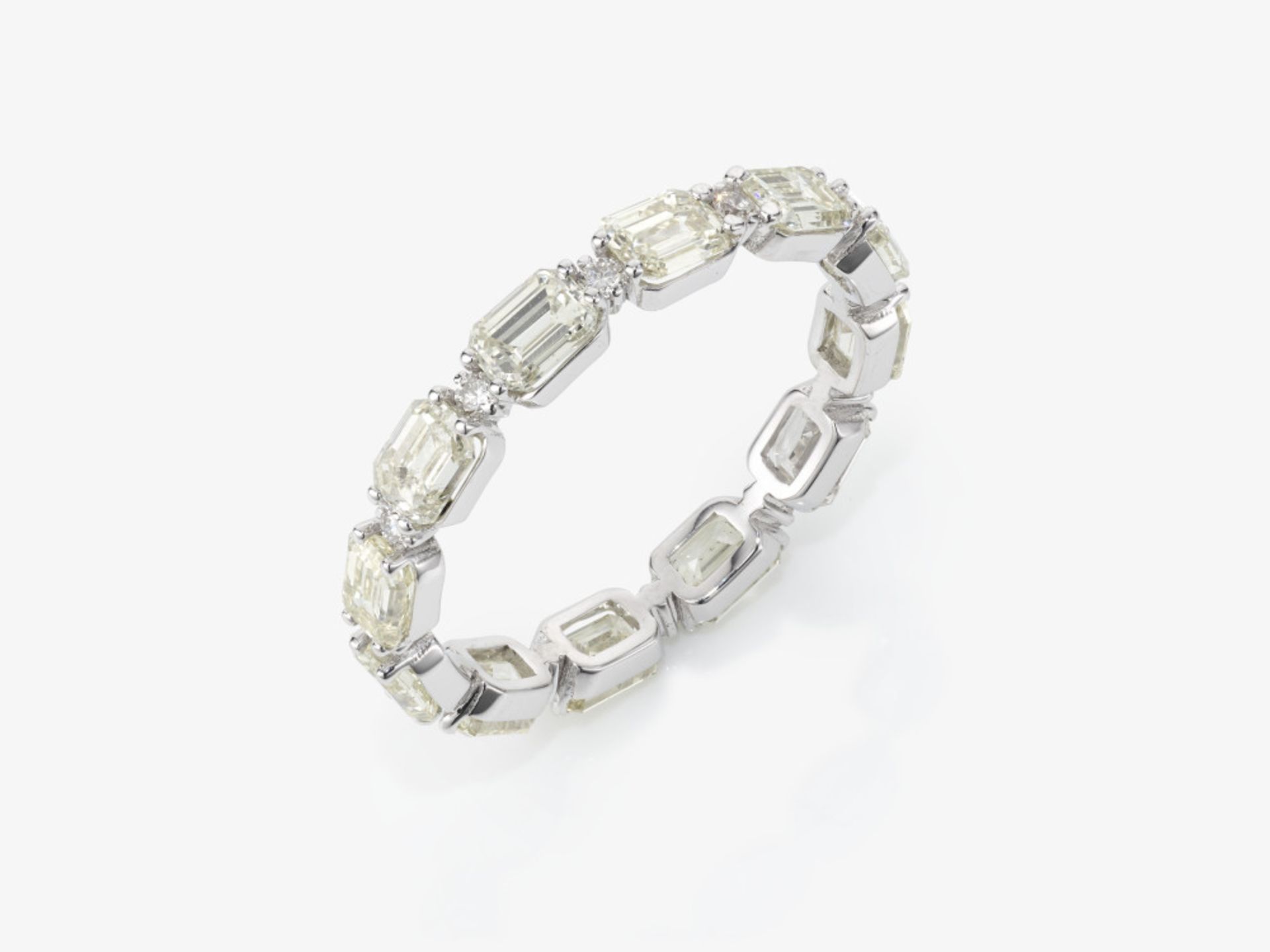 An eternity ring decorated with Collection baguette- and brilliant-cut diamonds