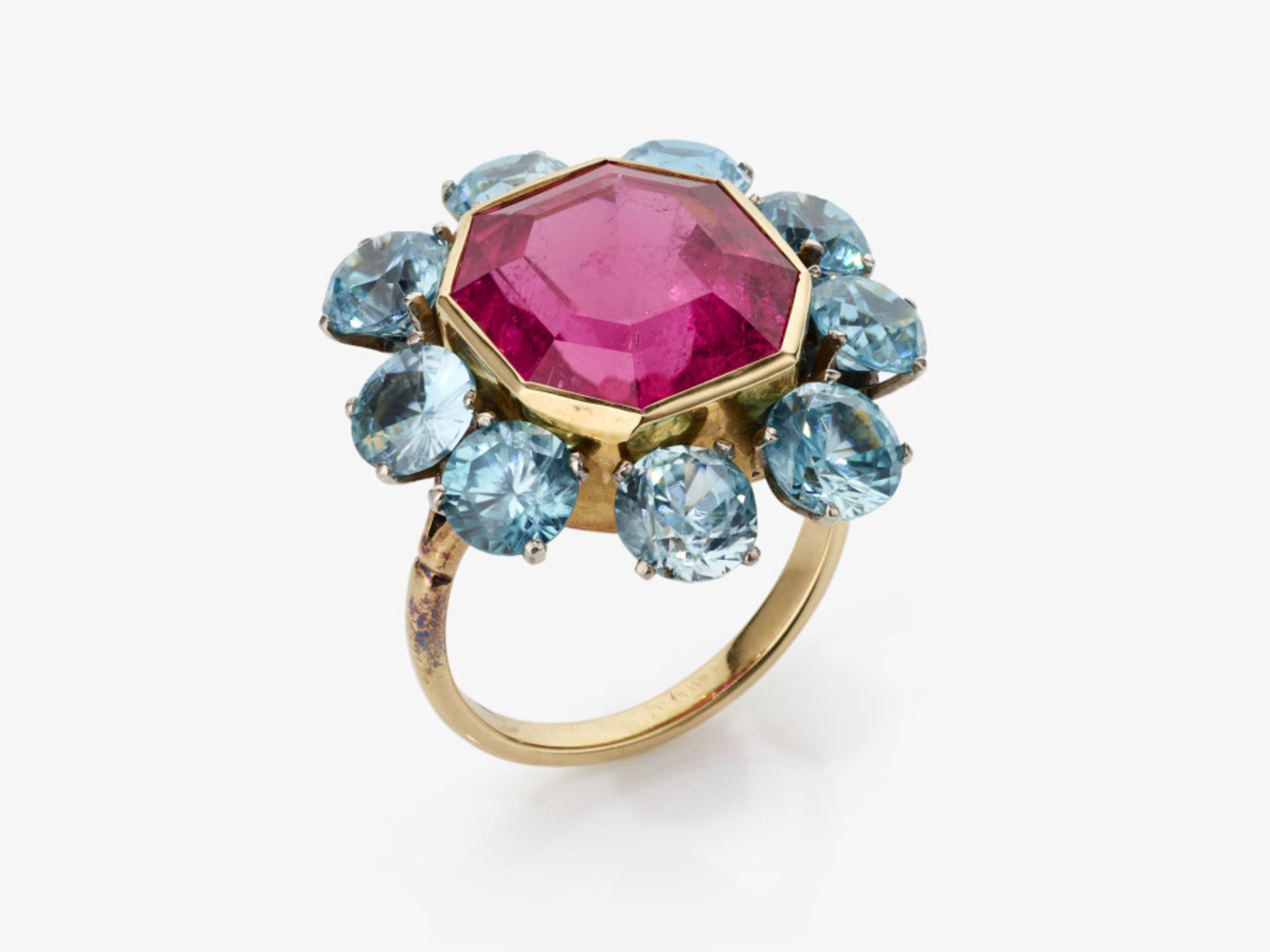 A historical cocktail ring with a rare "hot pink" rubellite and blue zircons