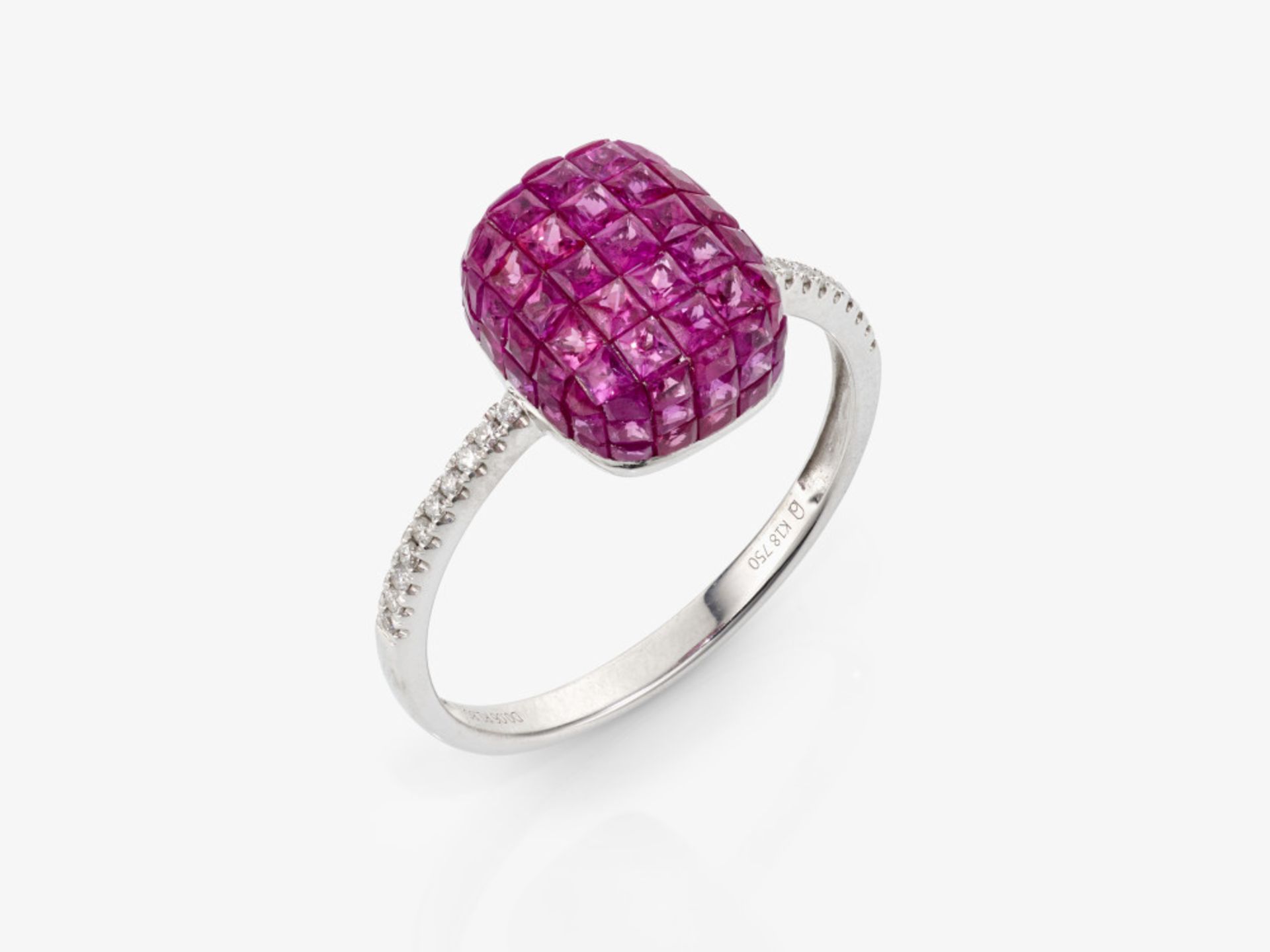 A modern delicate cocktail ring decorated with rubies and brilliant-cut diamonds