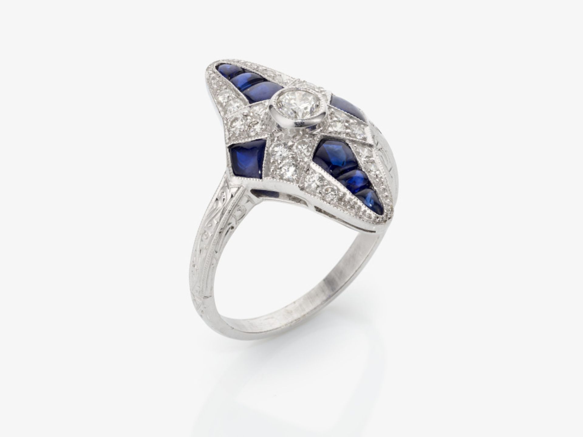 A historical marquise ring decorated with sapphires and brilliant cut diamonds