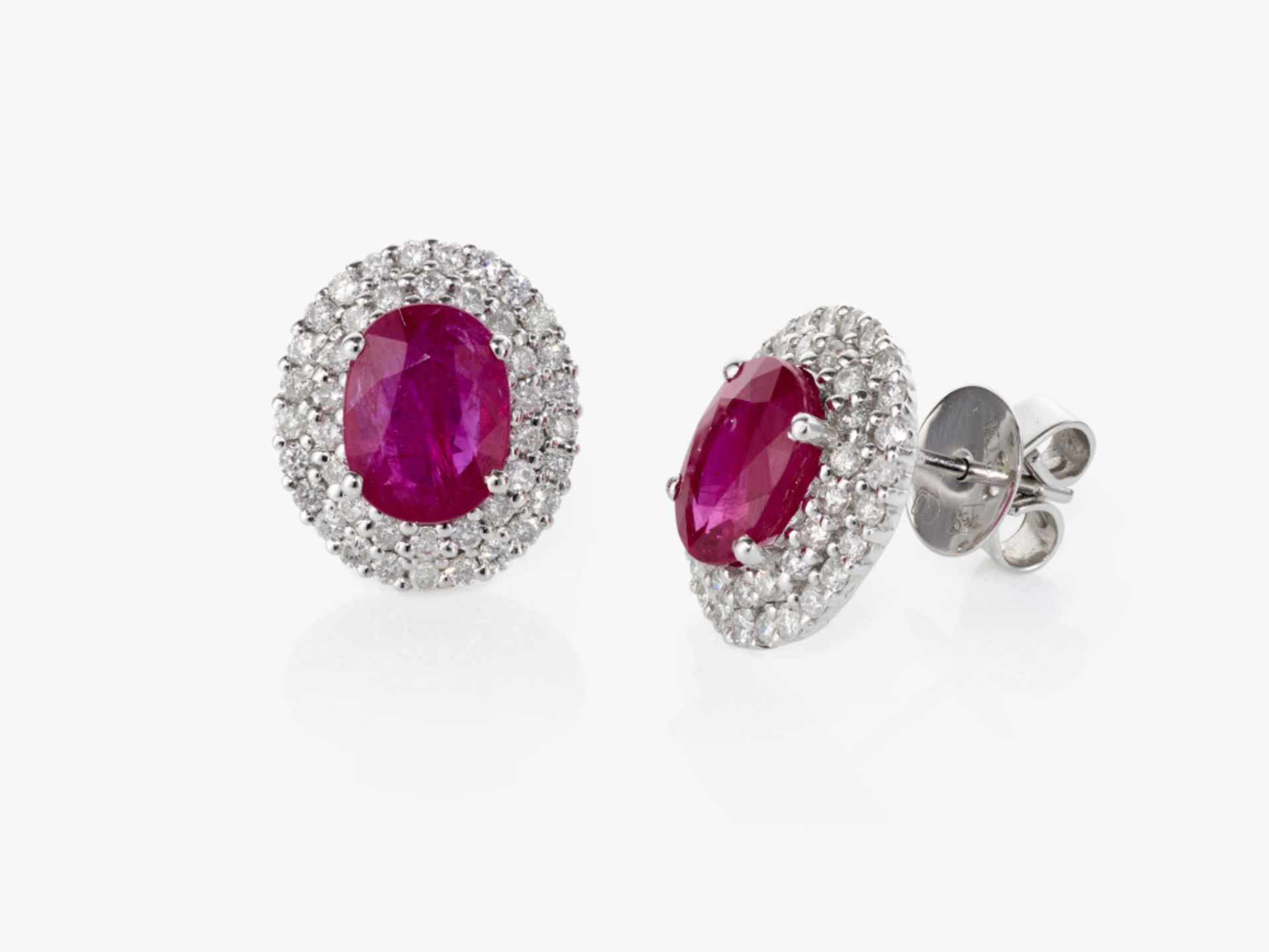 A pair of stud earrings decorated with brilliant-cut diamonds and rubies