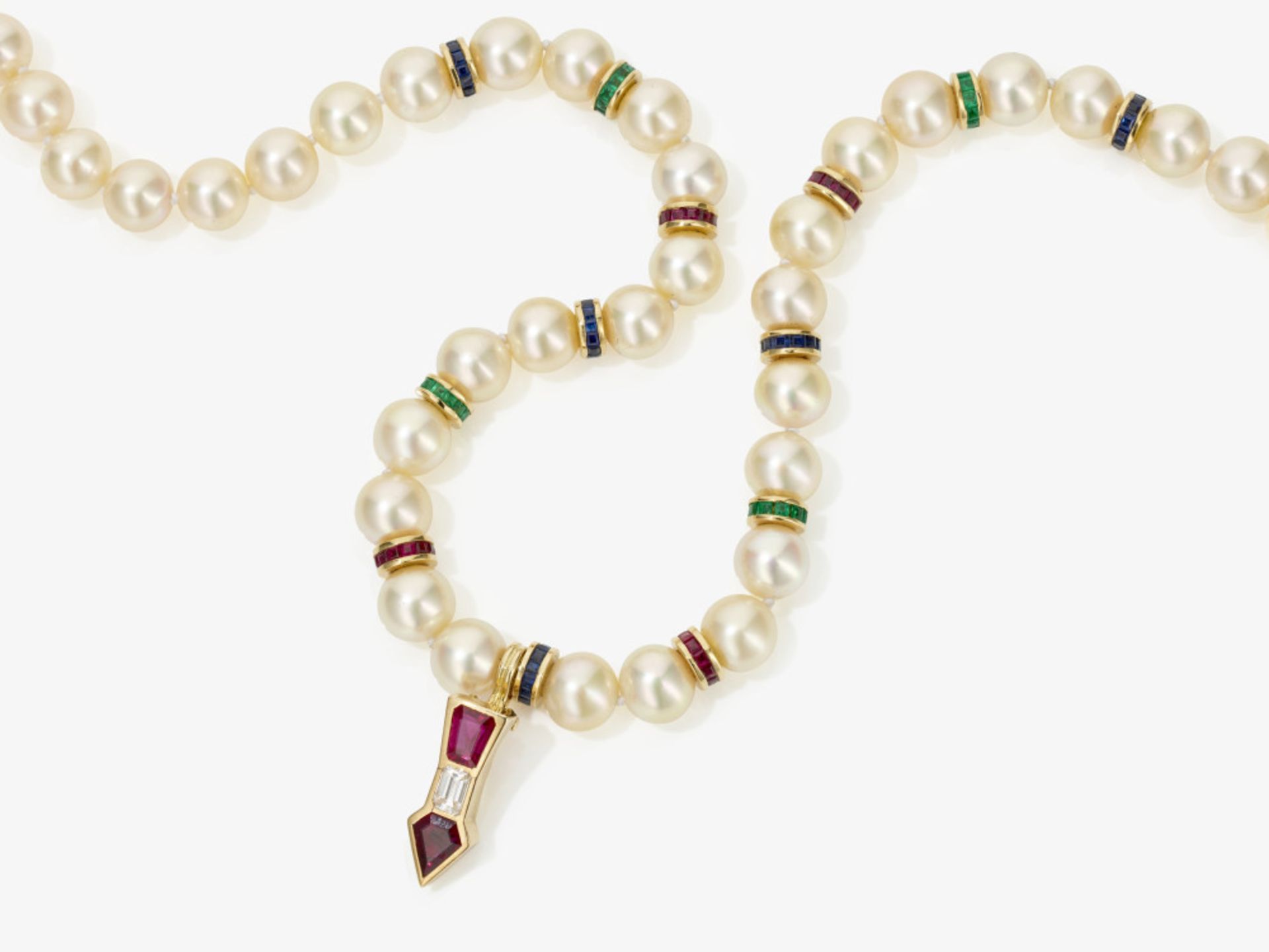 A cultured pearl necklace with a pendant with sapphires, emeralds, rubies and a diamond