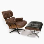 A lounge chair with ottoman - Design by Ray and Charles Eames for Vitra