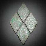 Four natural emerald tokens