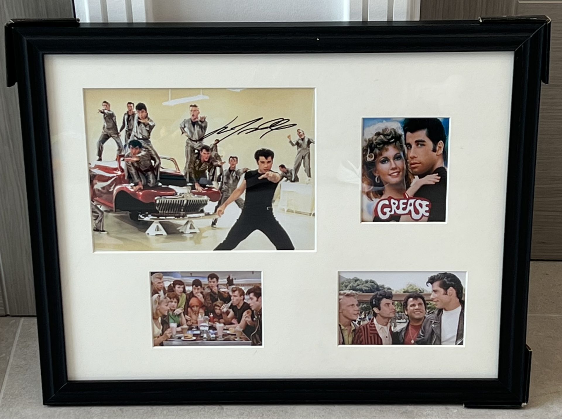 Movie Presentation of 'GREASE', HAND SIGNED by 'John Travolta' with COA