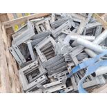 Crate of galvanised fixing brackets.