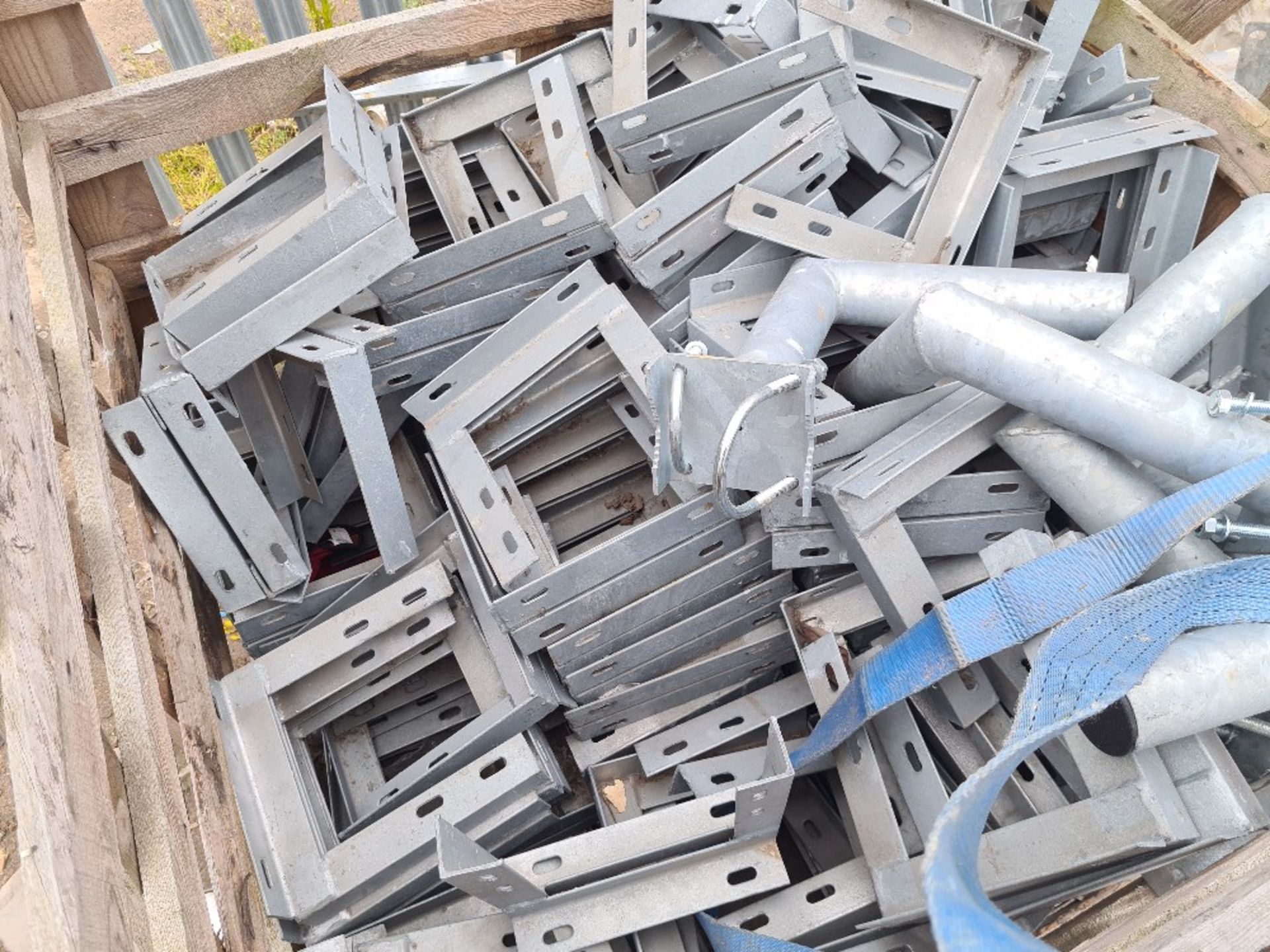 Crate of galvanised fixing brackets.