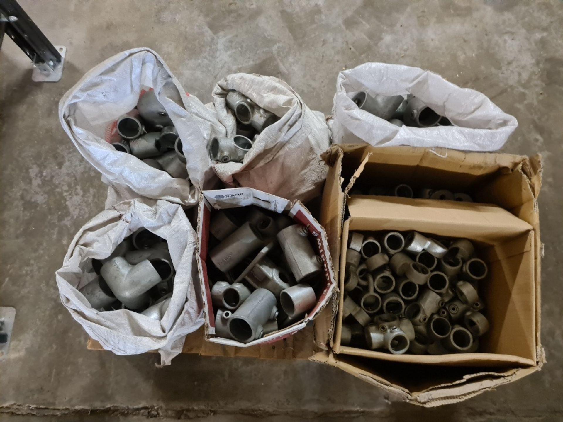 Pallet of various tubular fittings.