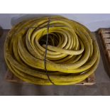 Pallet of yellow hose.