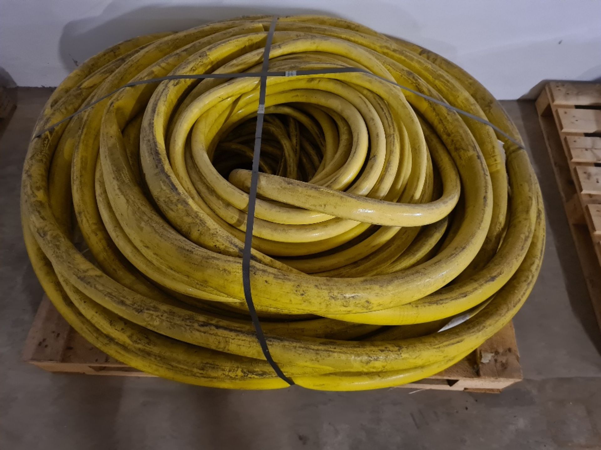 Pallet of yellow hose.