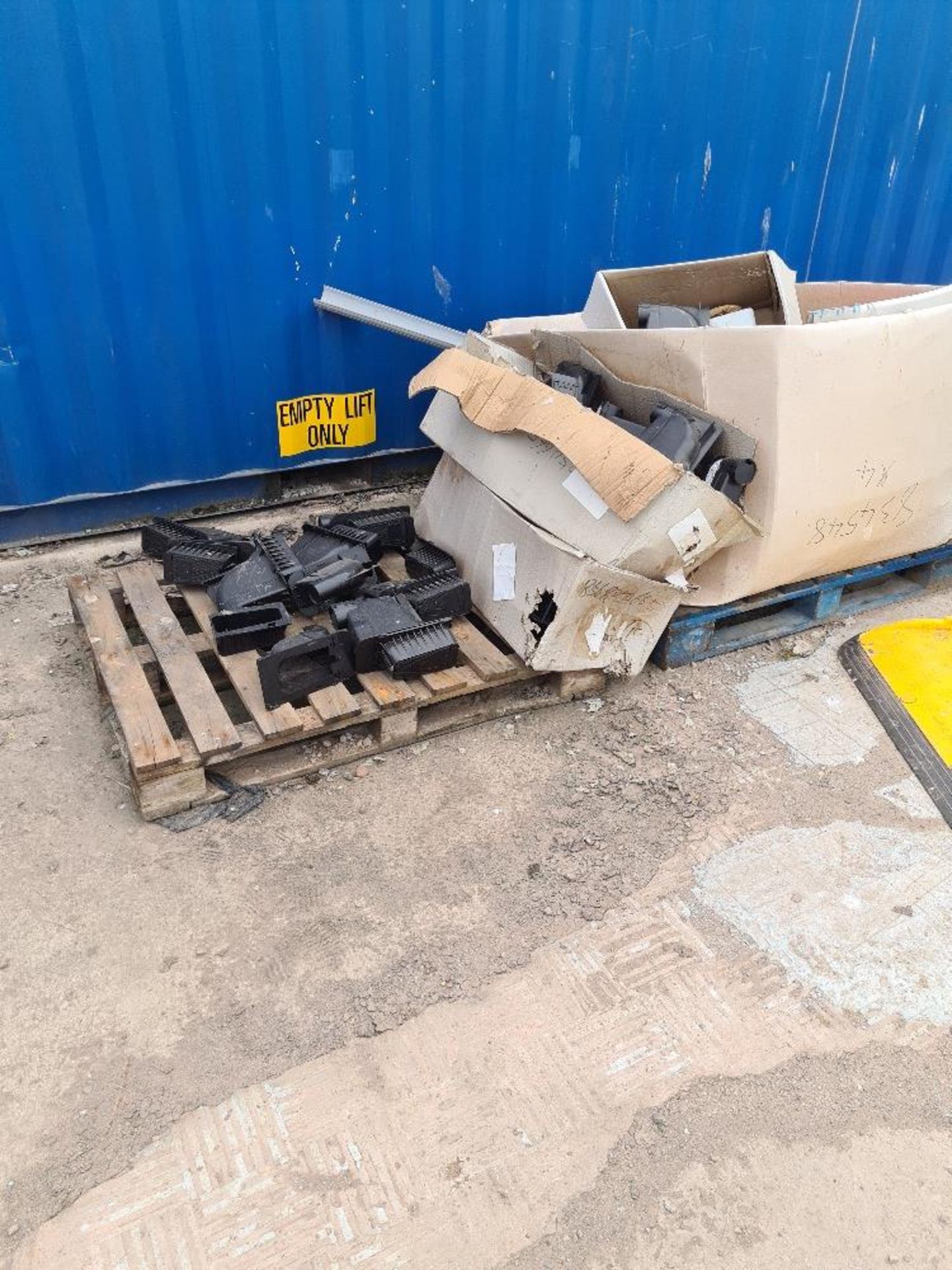 Pallet of black junction/termination boxes for tel