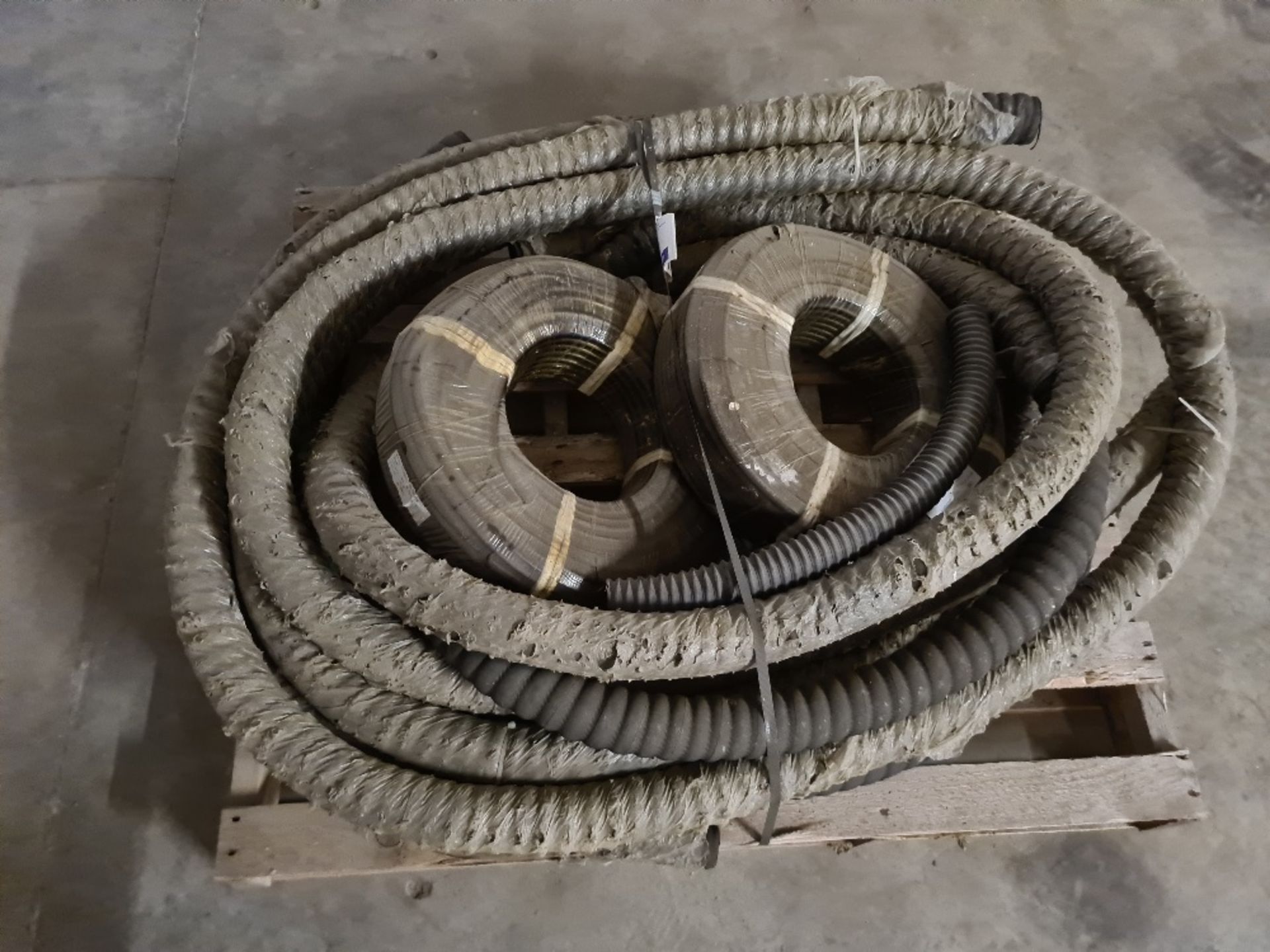 Pallet of exhaust hose and fuel pipe.