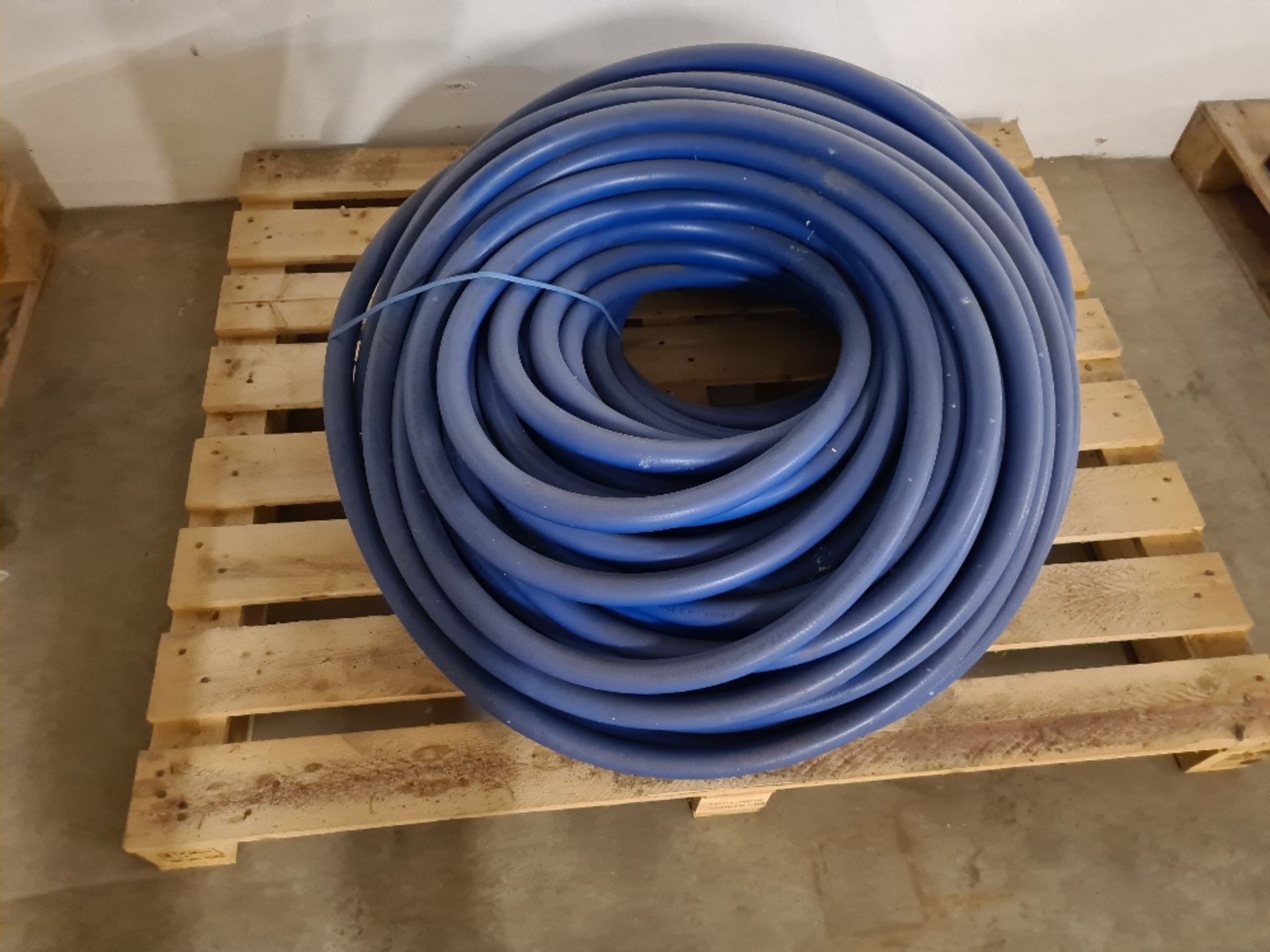 Pallet of blue hose.