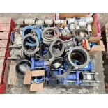 Pallet of isolation valves, pipe couplers and various items.