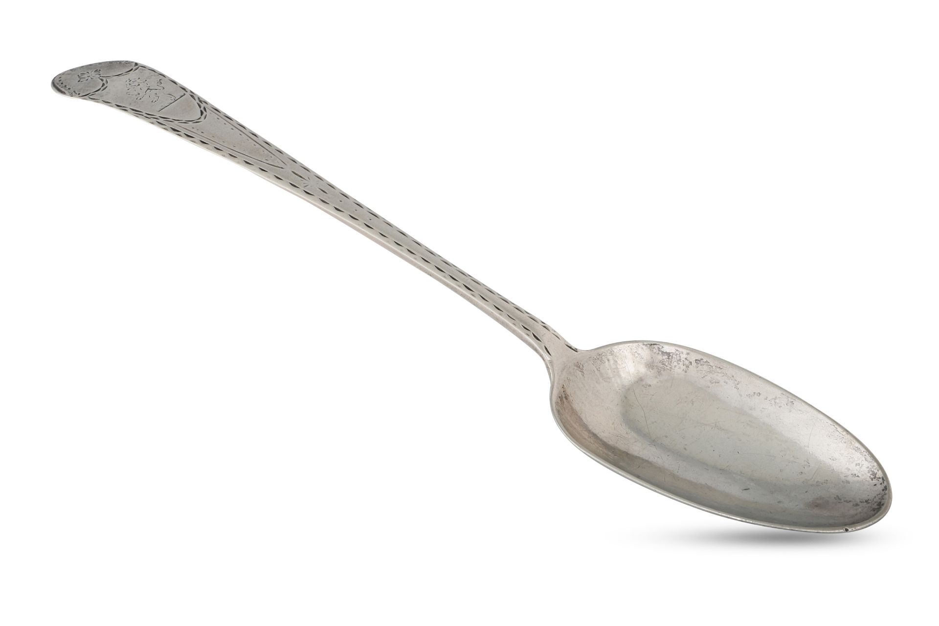 A GEORGE III IRISH PROVINCIAL STERLING SILVER BRIGHT CUT SERVING SPOON, crested & double punched, By