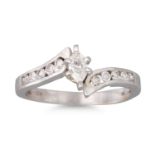 A DIAMOND CLUSTER RING, the marquise diamond to channel set shoulders, mounted in 14ct white gold,