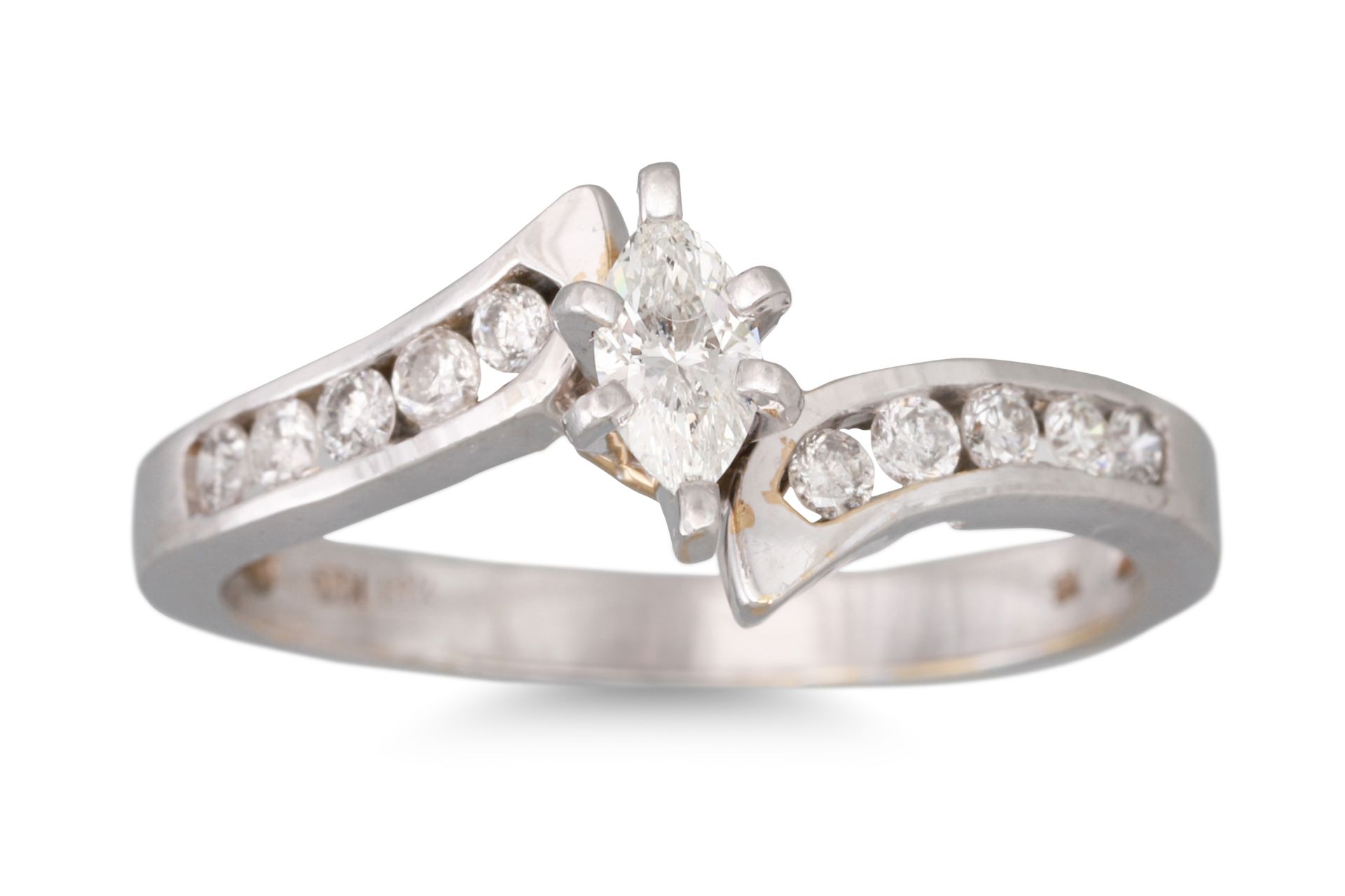 A DIAMOND CLUSTER RING, the marquise diamond to channel set shoulders, mounted in 14ct white gold,