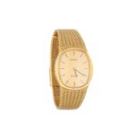 A MID SIZE SLIM LINE TISSOT STYLIST QUARTZ WRISTWATCH, in gold plate, champagne face with baton