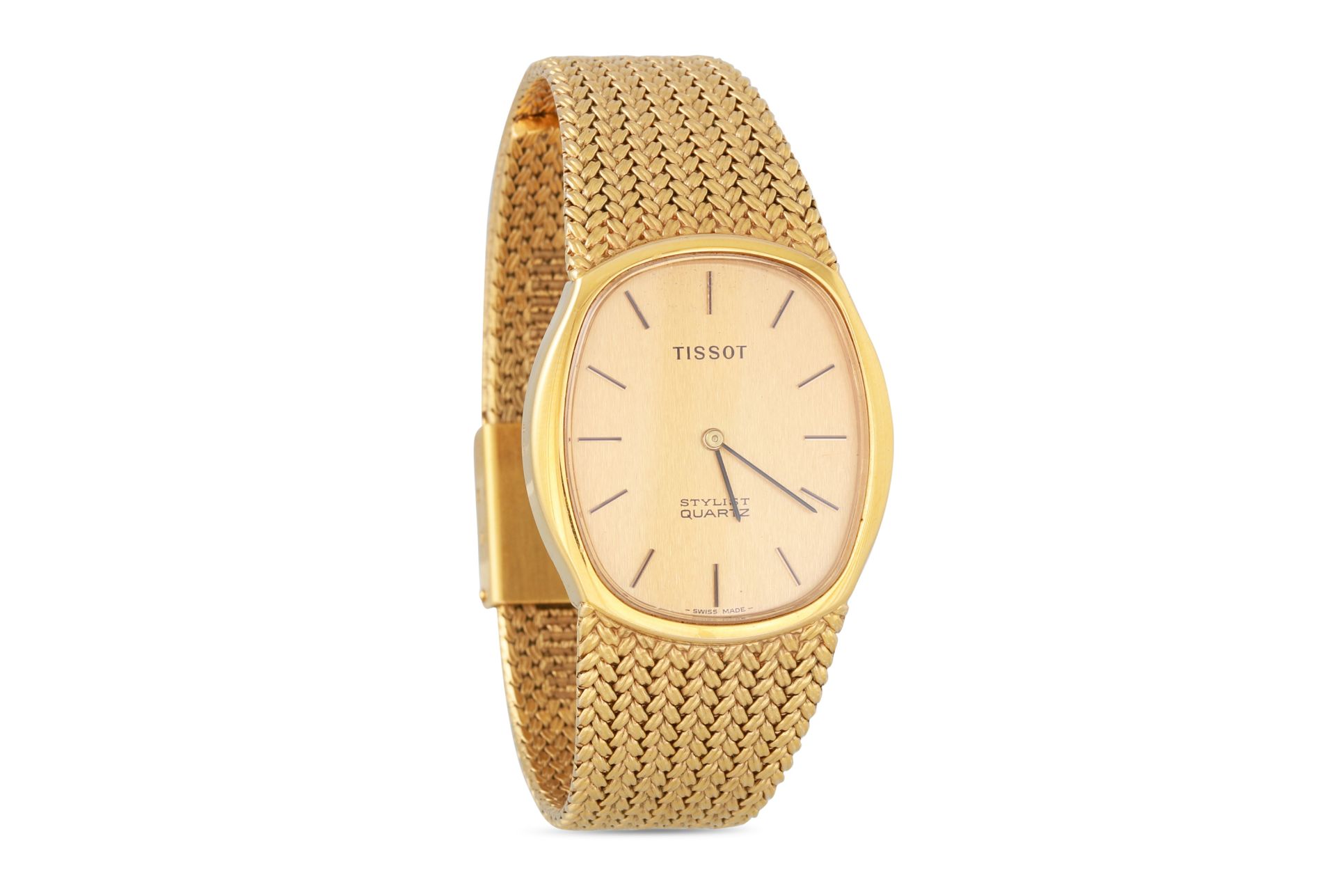 A MID SIZE SLIM LINE TISSOT STYLIST QUARTZ WRISTWATCH, in gold plate, champagne face with baton