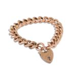 AN ANTIQUE 9CT HOLLOW CURB LINK BRACELET, with engraved padlock clasp, each link stamped